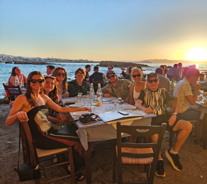 Family dinner in Crete at sunset